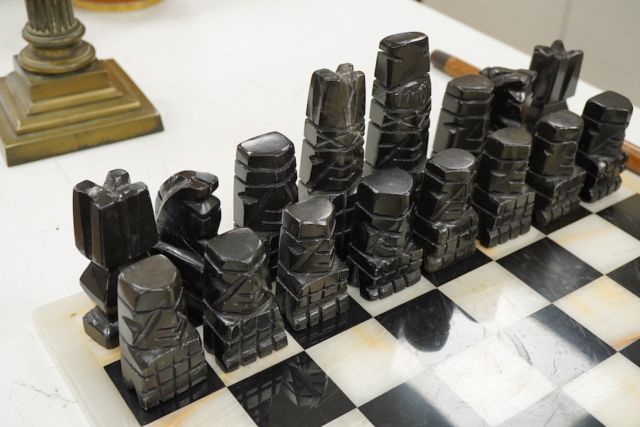 A black and white onyx chess set and board, largest piece, 14cm high